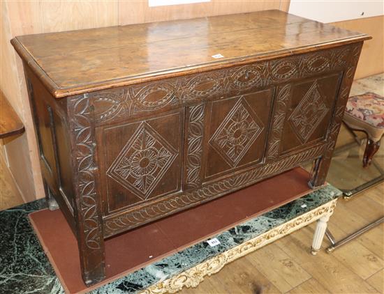 An early 18th century carved oak coffer W.117cm